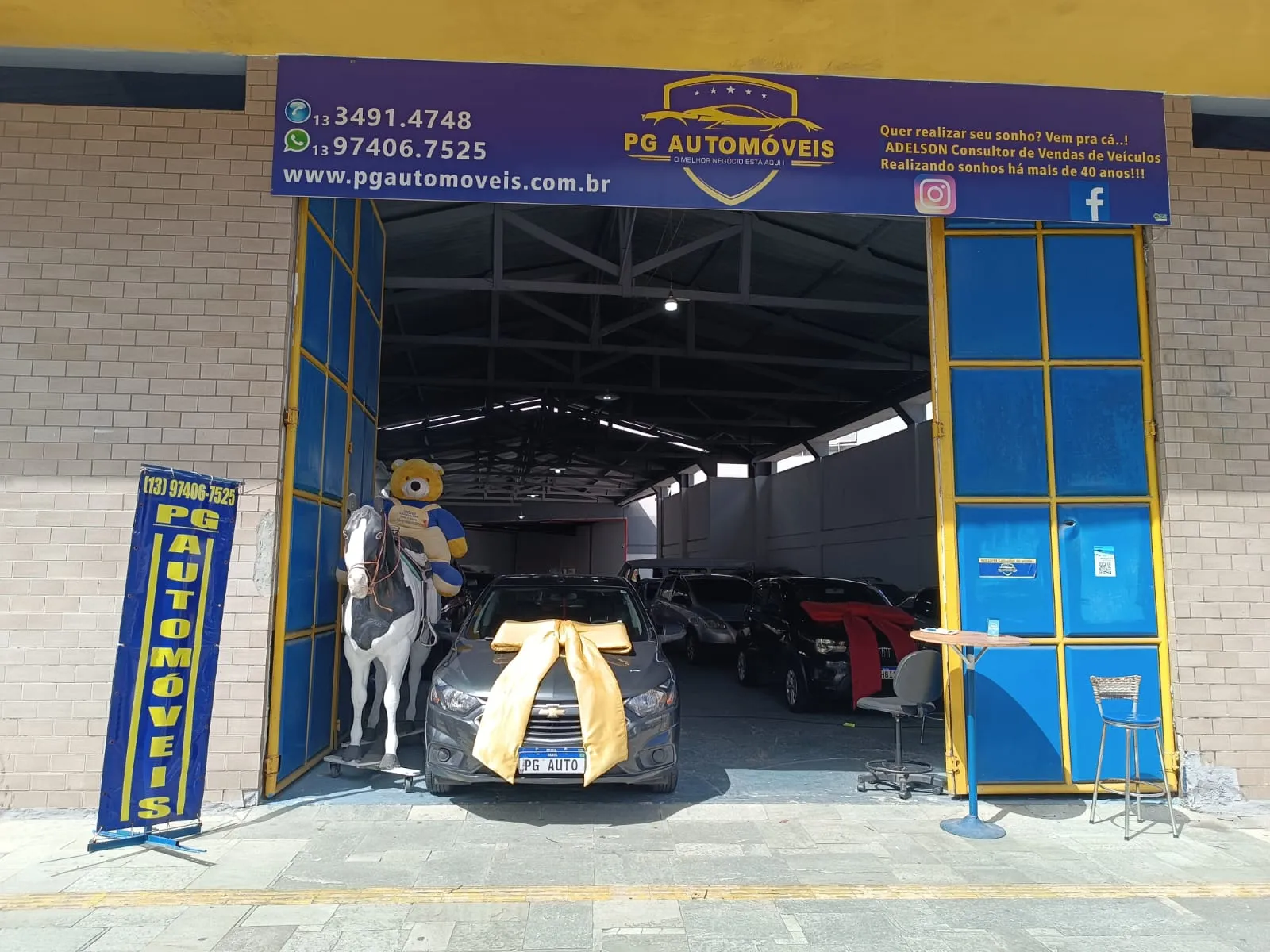 Fachada da loja Veículos à venda em PG Automóveis - Praia Grande - SP | Mobiauto
